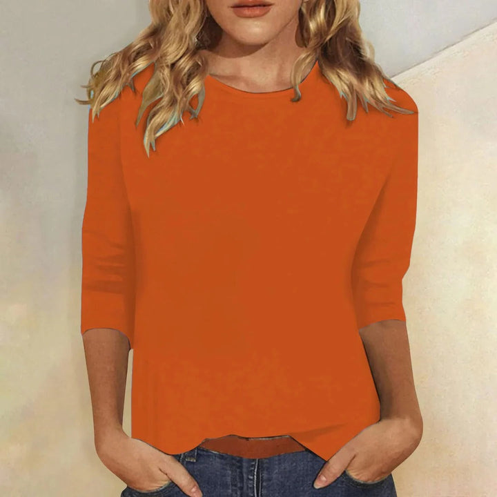 Relaxed fit women's 3/4 sleeve top in a crew neck style, great for versatile outfitting.