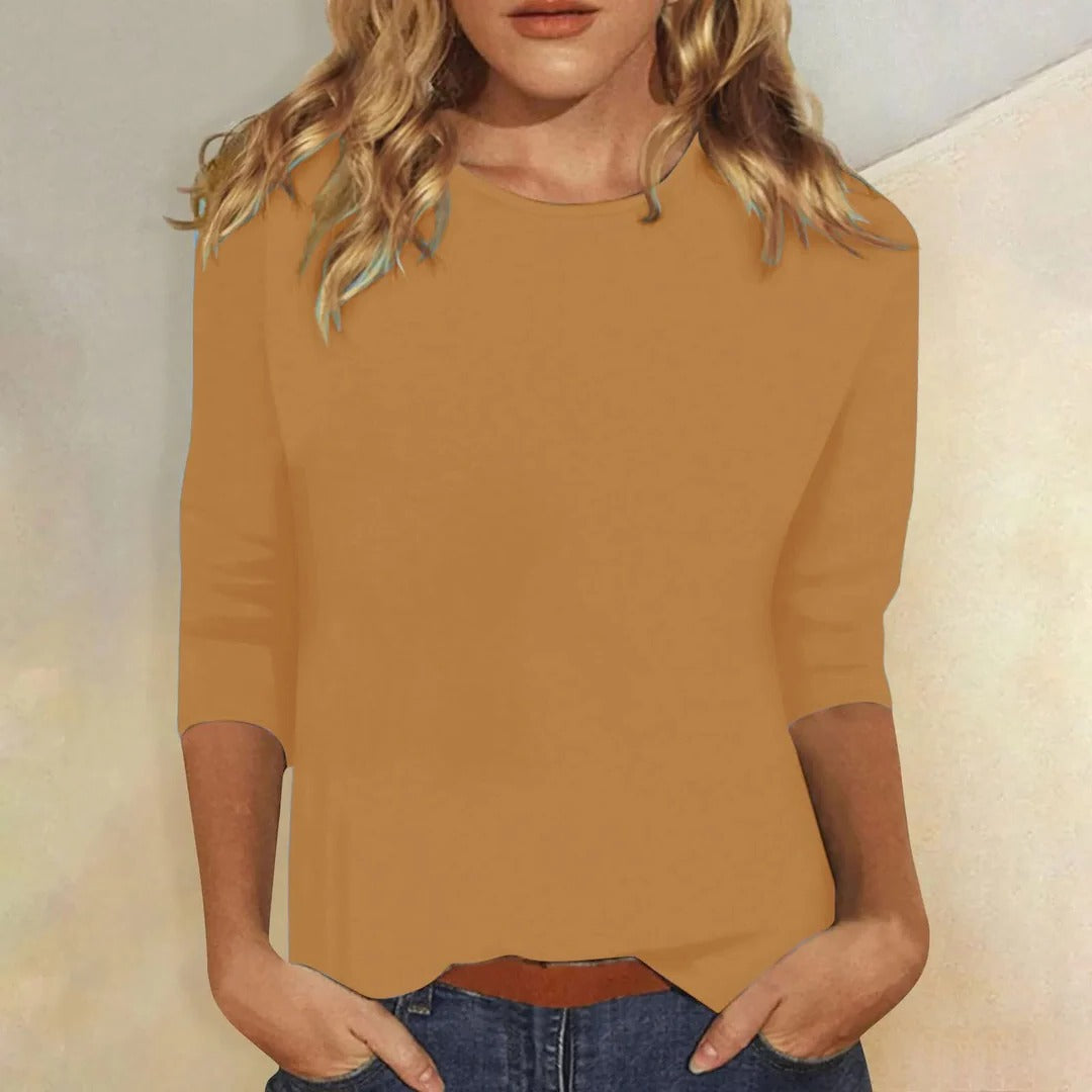 Classic women's crew neck 3/4 sleeve top, offering comfortable relaxed fit for any season.