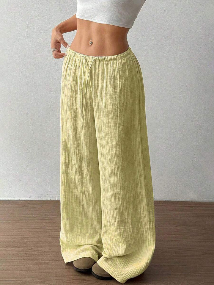 Everyday stylish women's wide leg drawstring pants, crinkle texture, perfect for relaxed summer fashion.
