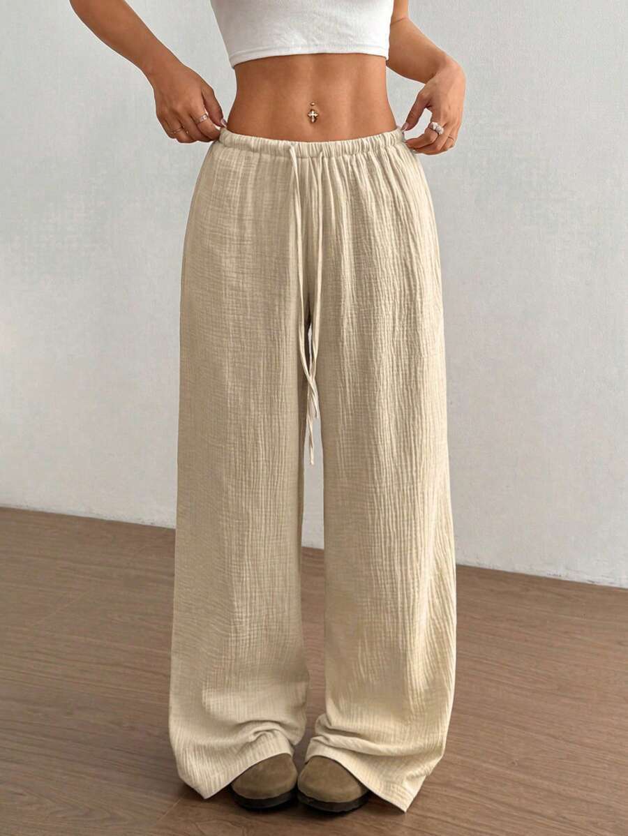 Chic women's crinkle texture wide leg pants, drawstring elastic waist, for comfortable bohemian style.