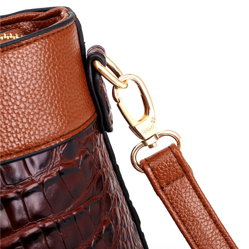 Women's elegant vintage handbag. Croc embossed texture, round top handle, versatile shoulder bag.