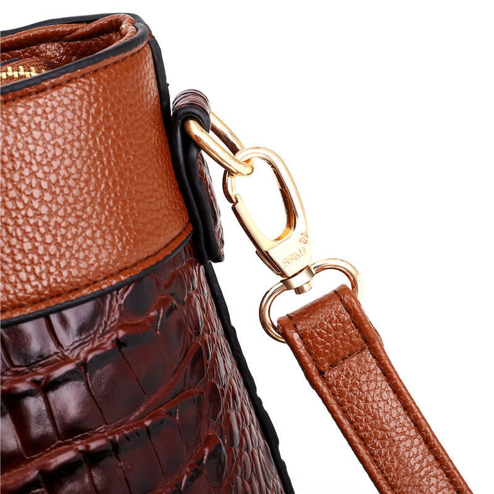 Women's elegant vintage handbag. Croc embossed texture, round top handle, versatile shoulder bag.