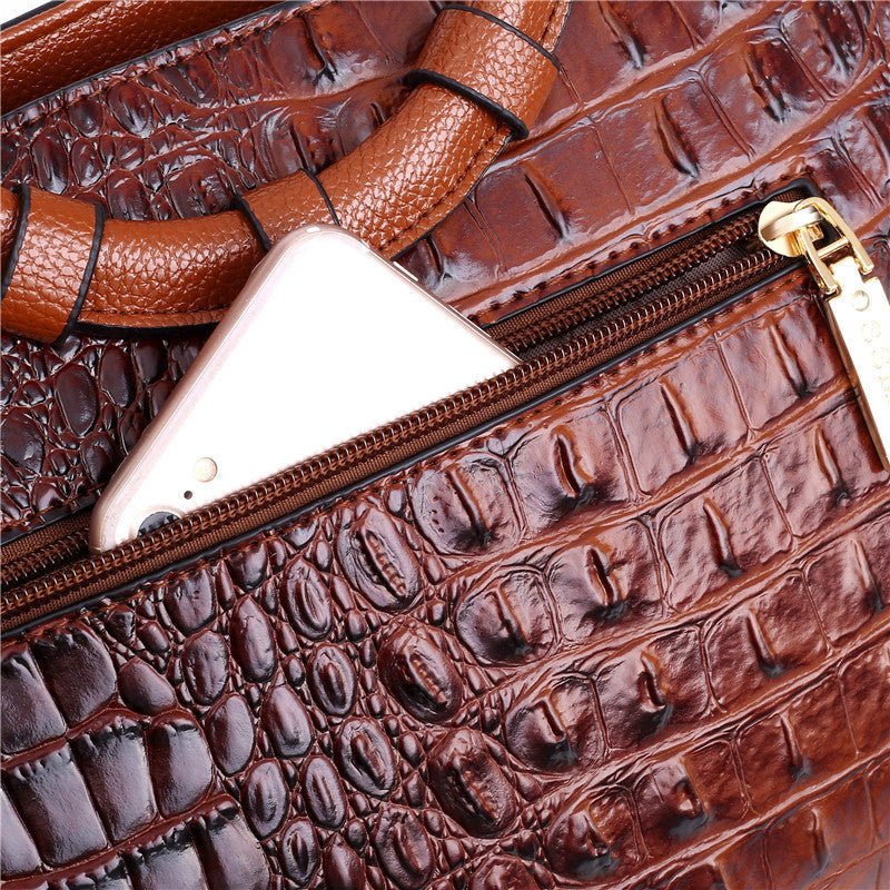 Timeless women's croc embossed handbag with a sophisticated round handle. Vintage luxury style.