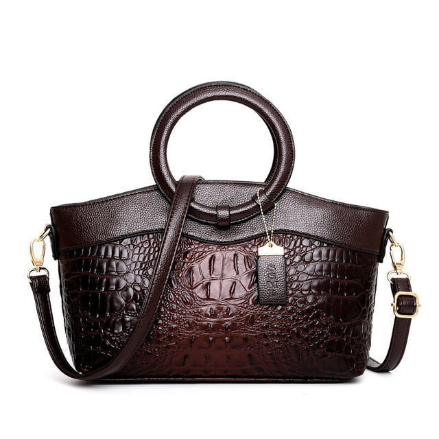 Women's croc embossed vintage shoulder bag, featuring a luxurious look & sturdy round handle.