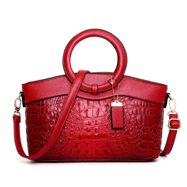 Women's versatile vintage handbag, croc embossed faux leather. Elegant, with a striking round handle.