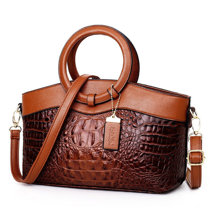 Luxurious croc embossed vintage handbag for women, featuring a stylish round top handle.