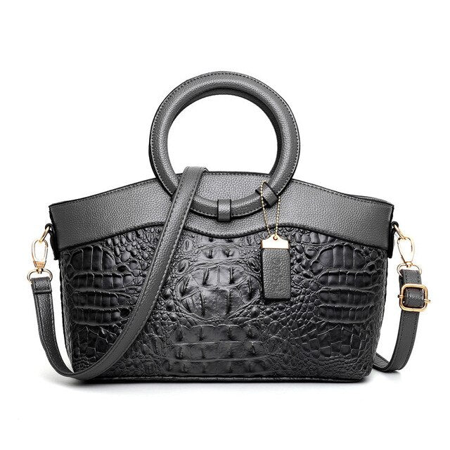 High-quality women's vintage croc embossed handbag, featuring a luxurious feel & round handle.