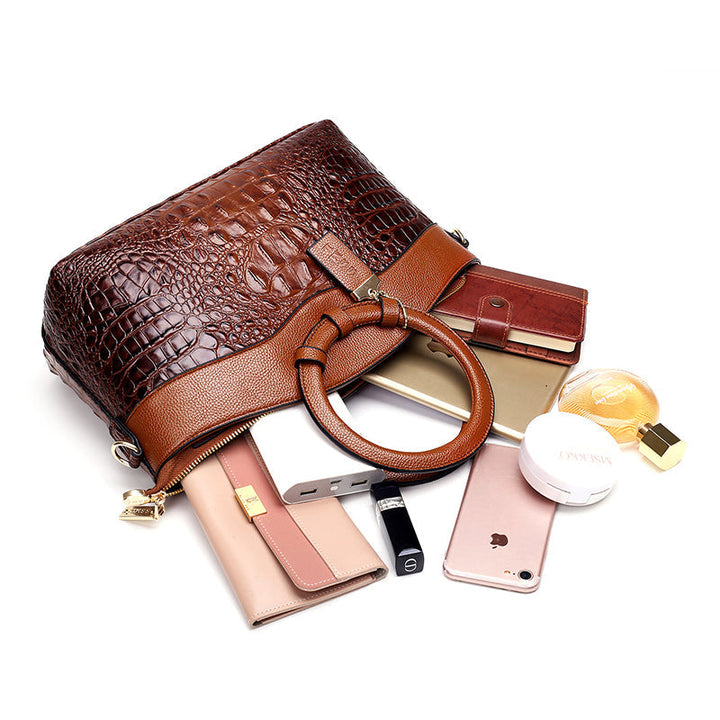 Versatile women's vintage handbag. Croc embossed faux leather with chic round top handle.