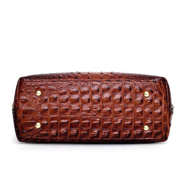 Sophisticated women's handbag: croc embossed faux leather, vintage design, iconic round handle.
