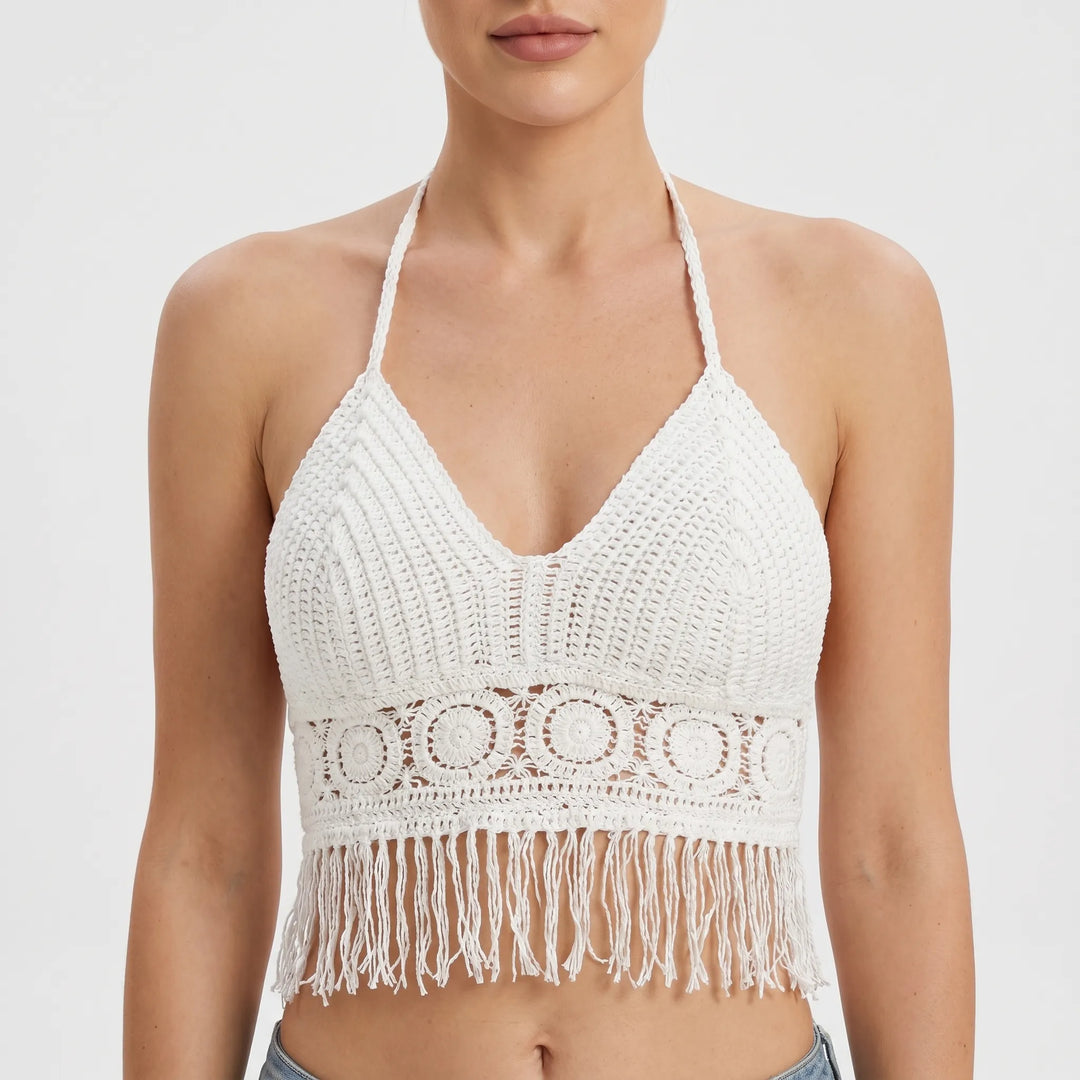 Bohemian white crochet halter crop top with fringe, perfect for summer fashion.