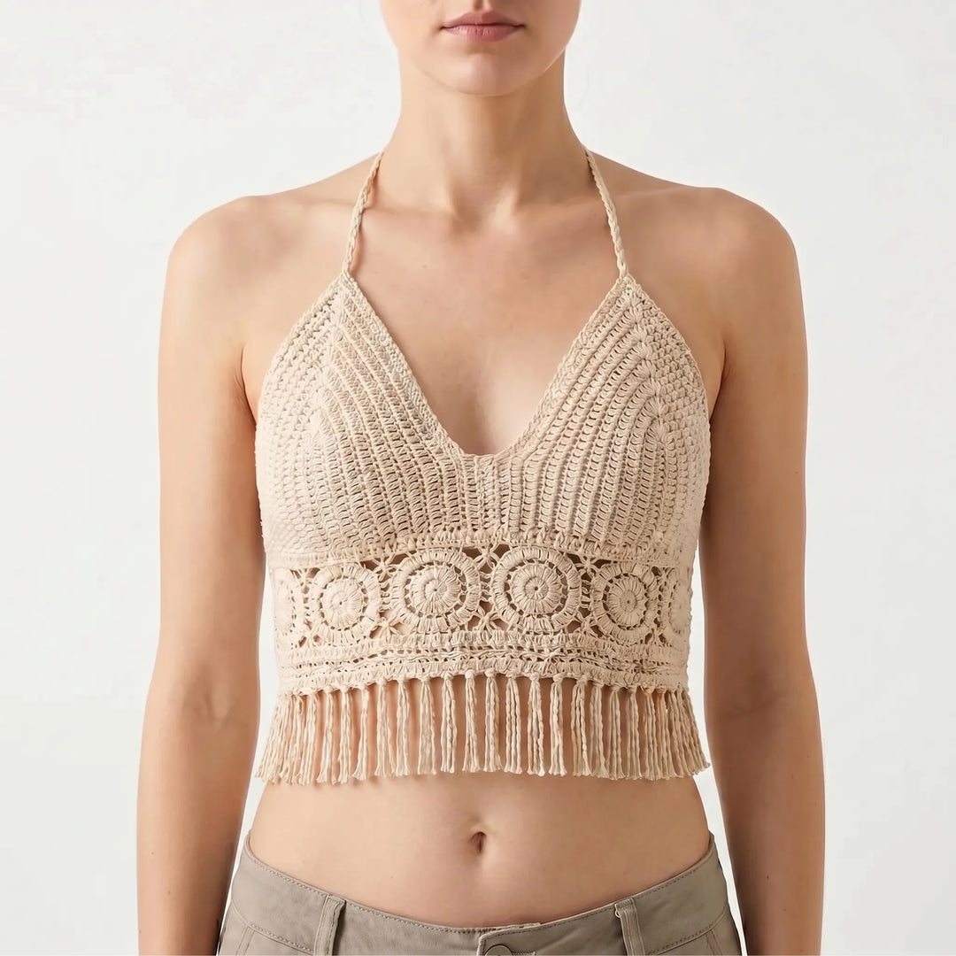 Fringed women's crochet halter crop top with open stitch design, ideal for beach or casual wear.