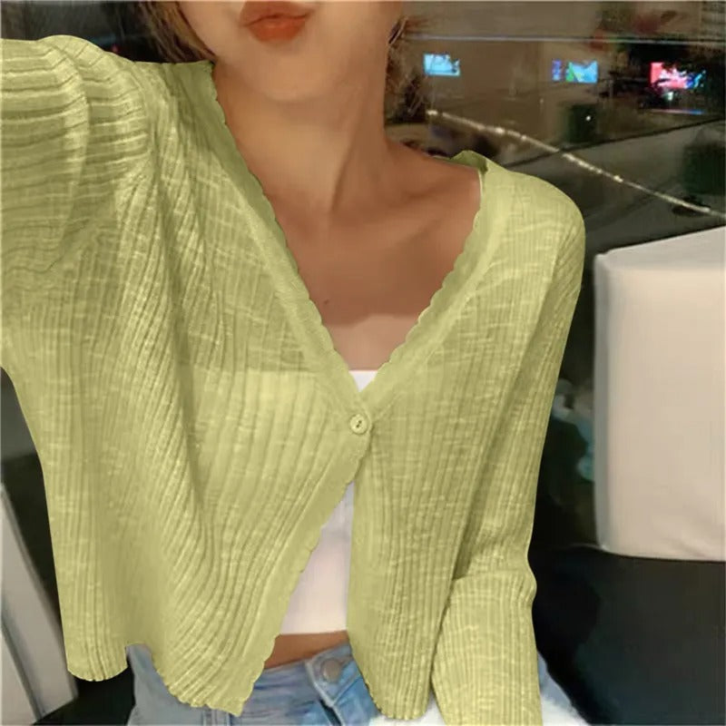 Lightweight cropped summer cardigan for women, featuring a button front and long sleeves, ideal for warm weather.
