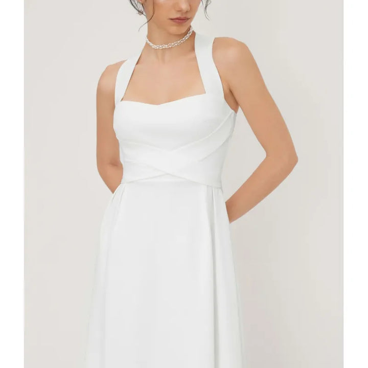 Women's elegant midi dress with unique cross-waist and stylish square neckline. Perfect sleeveless summer fashion.