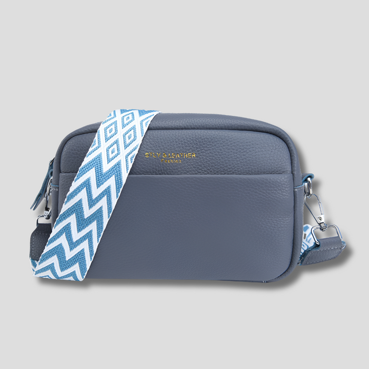 Elegant black women's crossbody bag. Features a trendy geometric strap, perfect as a fashion accessory.