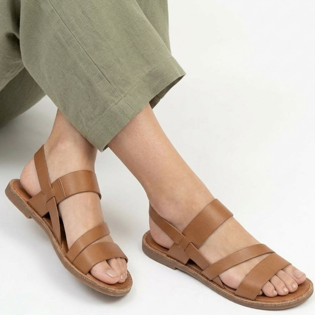 Elegant women's flat sandals, crossover strap style for stylish warm weather outfits.