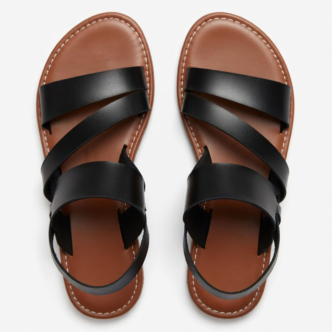 Women's comfortable flat sandals with crossover straps, great for beach & everyday use.