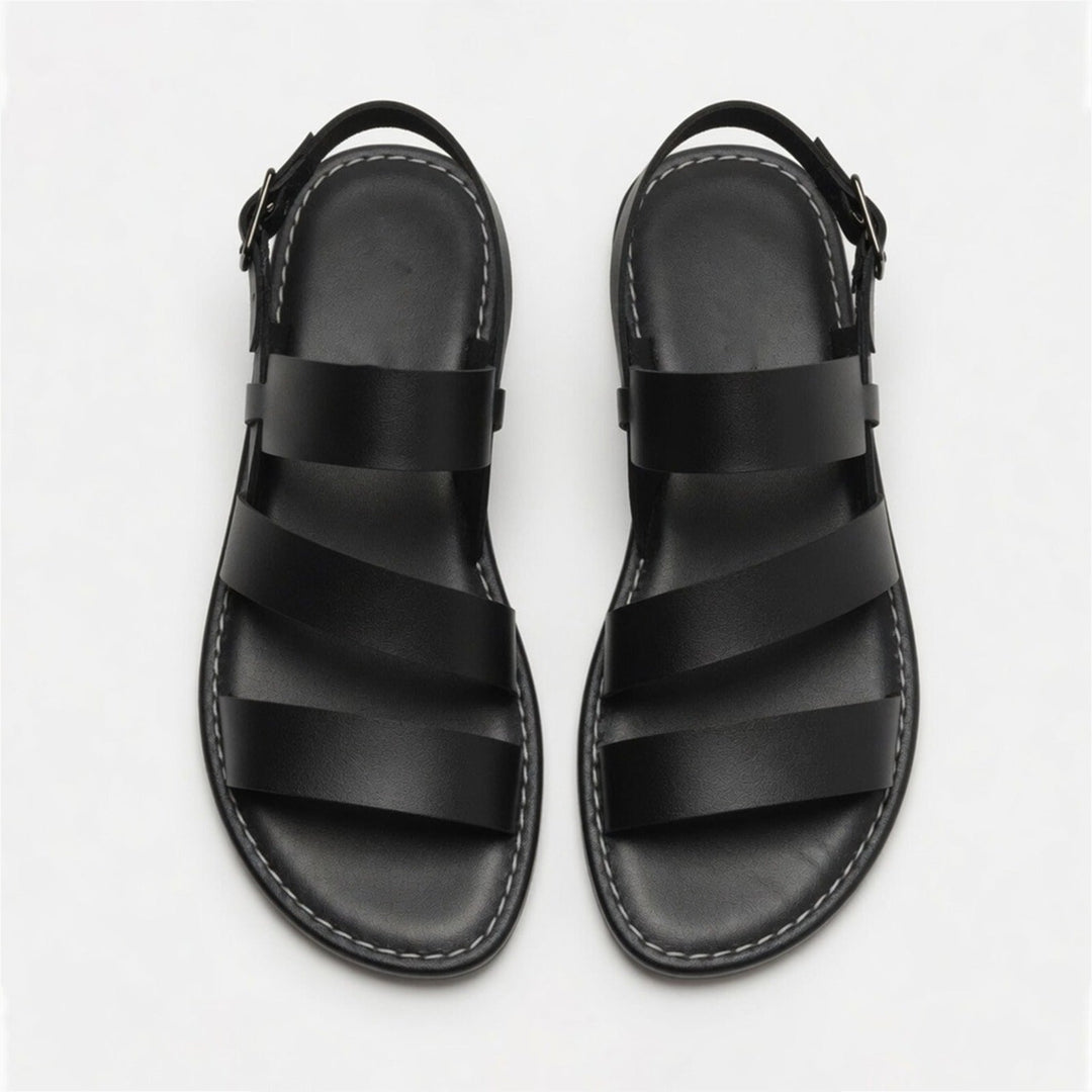 Fashionable women's flat sandals, open toe with supportive crossover strap design.