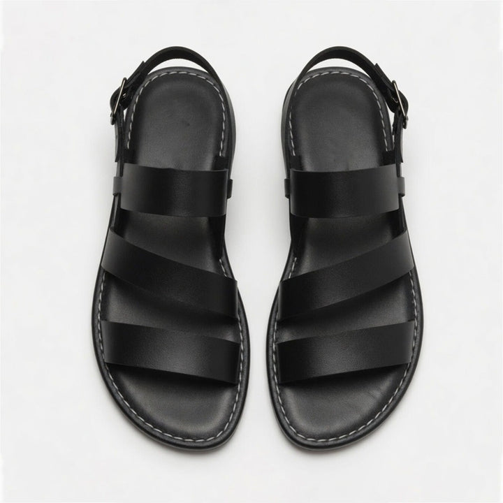 Fashionable women's flat sandals, open toe with supportive crossover strap design.