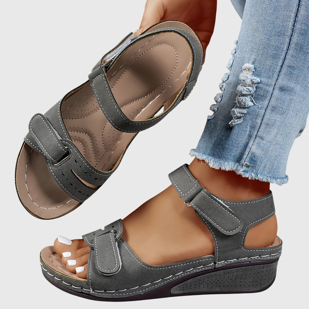 Stylish women's walking sandals, orthopedic design, crystal embellishments, comfortable slip-on.