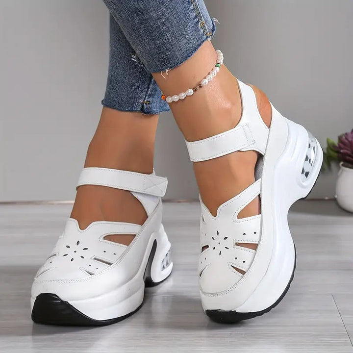 Comfortable women's orthopedic wedge sandals with cushioned platform & adjustable straps for summer style.