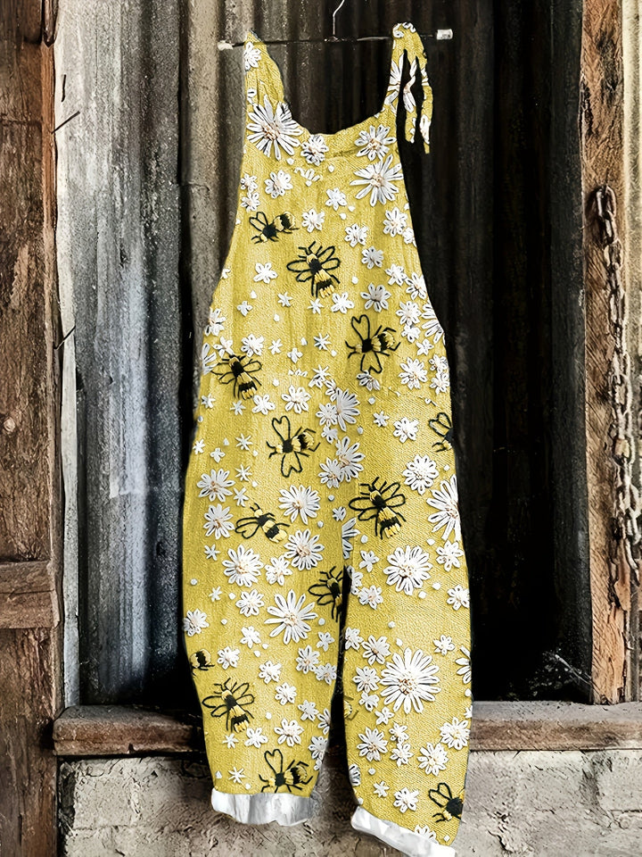 Women's casual pocket jumpsuit with daisy bee print, stylish tie shoulders & wide leg.