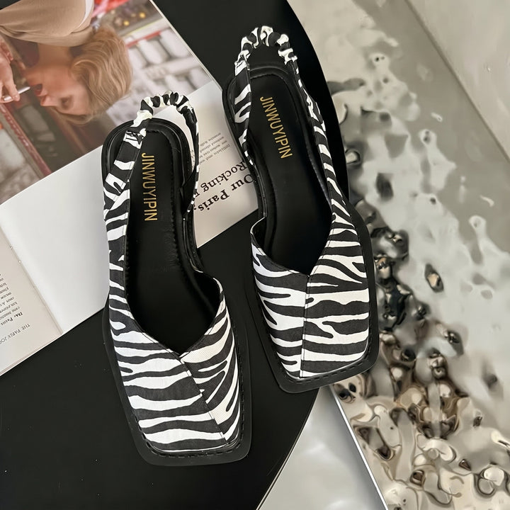 Comfortable women's fashion sandals: square toe, slingback, and a stable low block heel. Great for spring.