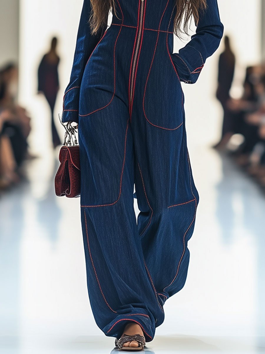 Women's dark blue wide leg jumpsuit with long sleeves & zip front. Modern, chic, and comfortable for any occasion.