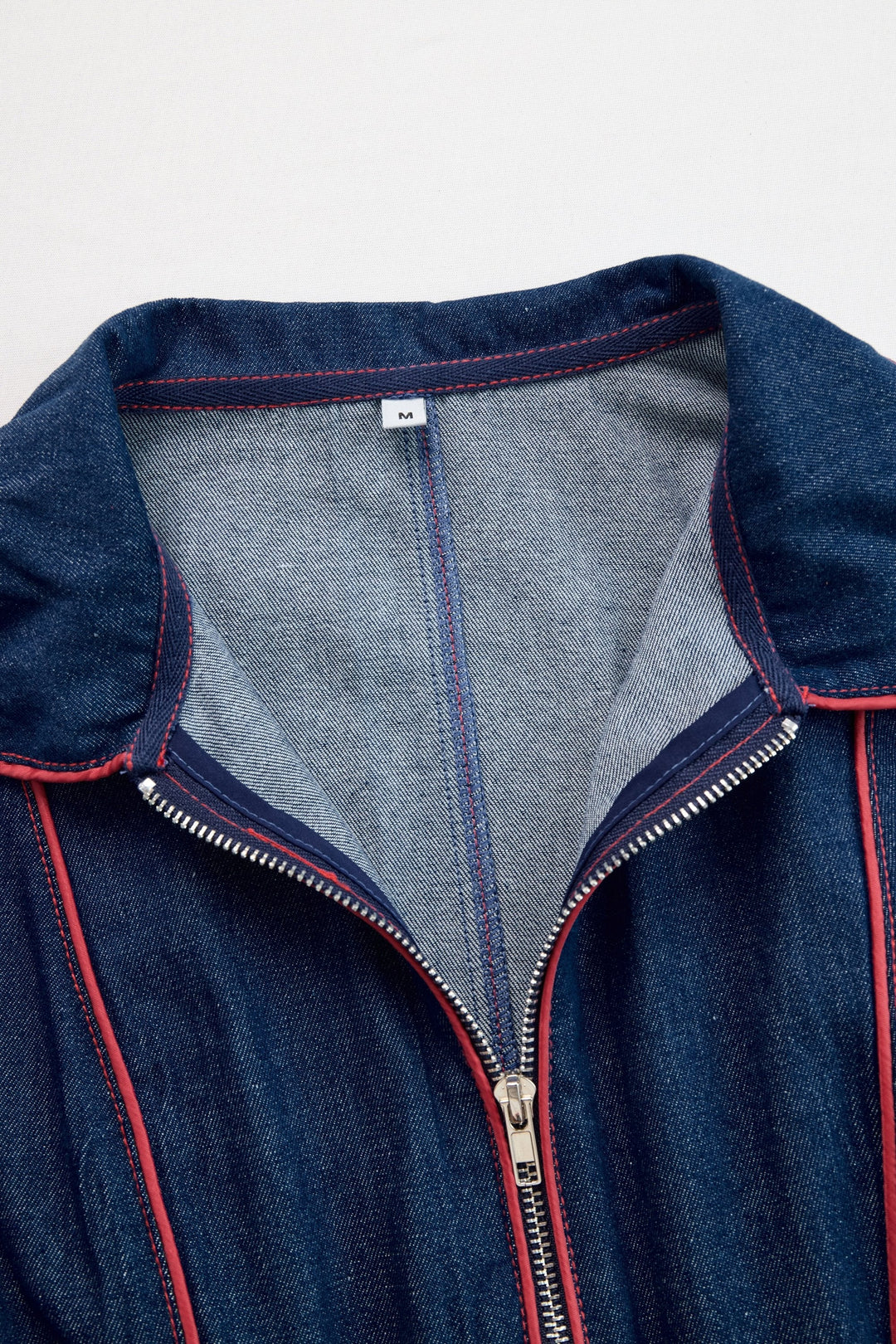 Women's dark blue wide leg jumpsuit, long sleeve, zip front. A stylish and comfortable casual-to-smart-casual option.
