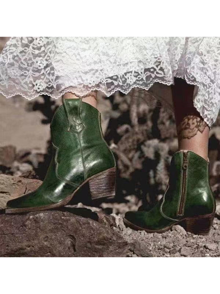 Casual women's snip toe ankle boots in dark green. Western-inspired cowgirl boots with a sturdy block heel.
