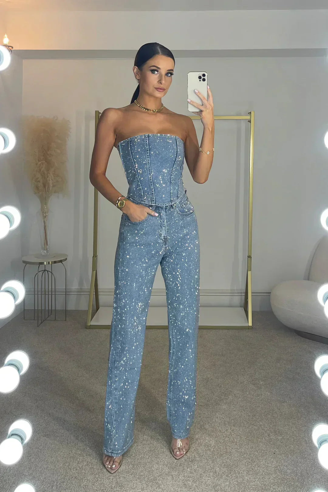 Detail of sparkling fabric on women's glitter crop top. Dazzling party fashion.