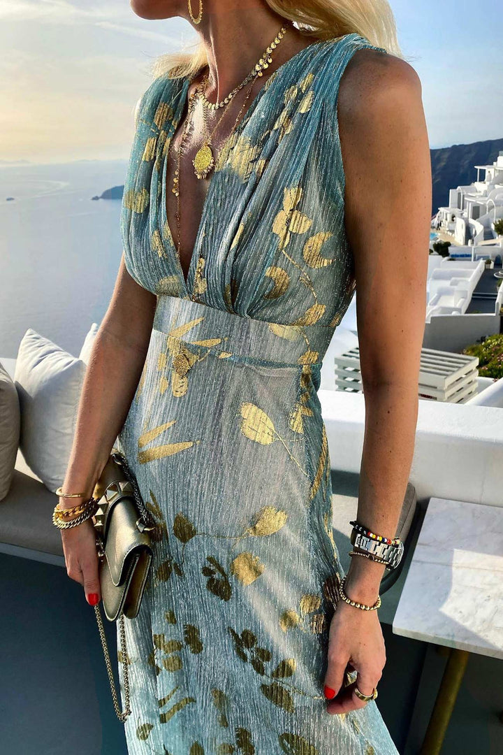Elegant deep V-neck women's summer tank dress with dazzling golden star print, great for evening or vacation.