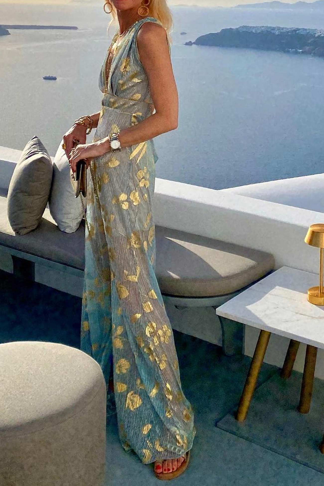 Women's sleeveless deep V-neck tank dress showcasing a vibrant golden star metallic pattern.