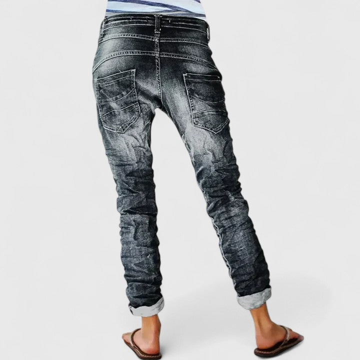 Women's distressed wide leg jeans, mid-rise, relaxed fit for casual vintage style.