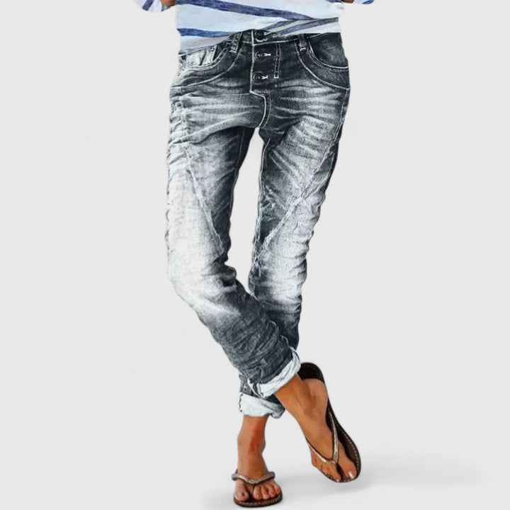 Comfortable women's distressed wide leg jeans, relaxed fit, mid-rise, trendy blue vintage style pants.