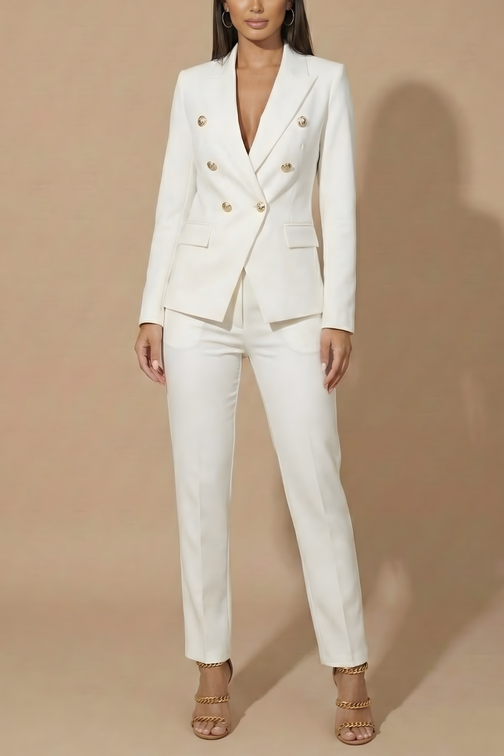 Back view of a women's tailored trouser suit with a double-breasted blazer. Perfect formal wear, elegant design.