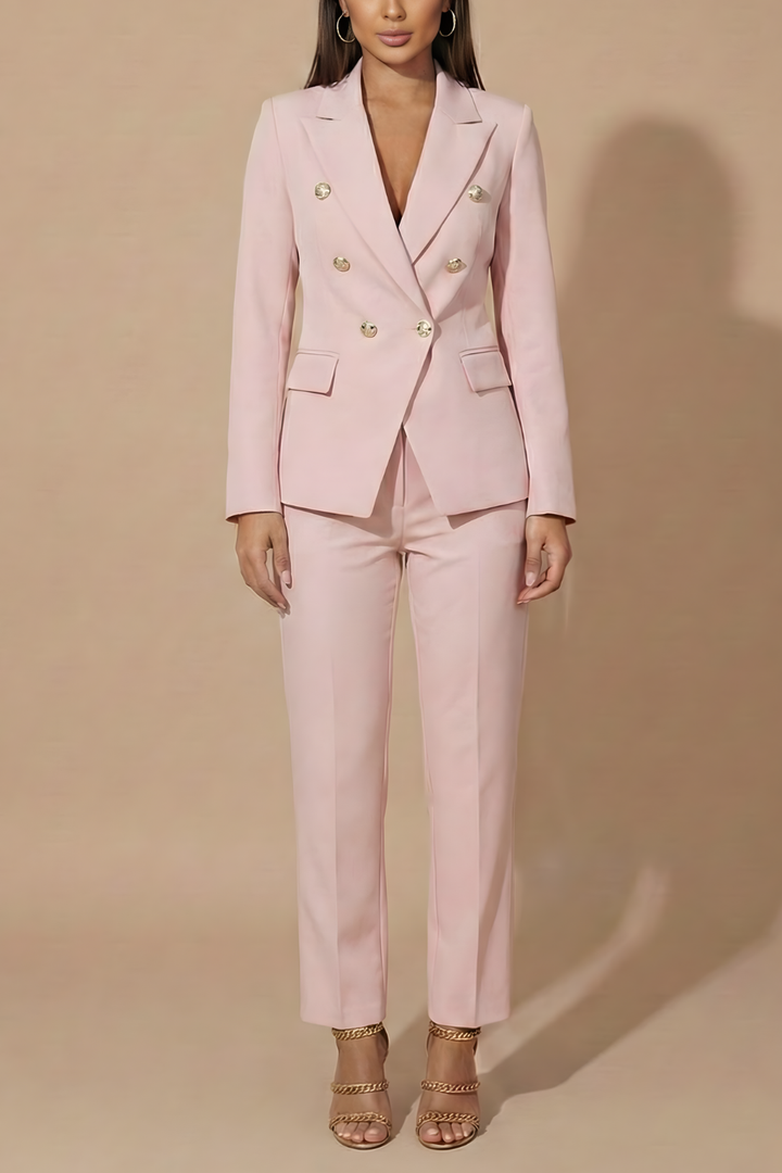 Textured fabric detail of a women's professional double-breasted blazer and tailored trouser suit.