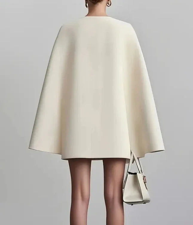 Sophisticated women's formal mini dress, featuring a double-breasted design & stylish cape sleeves for events.