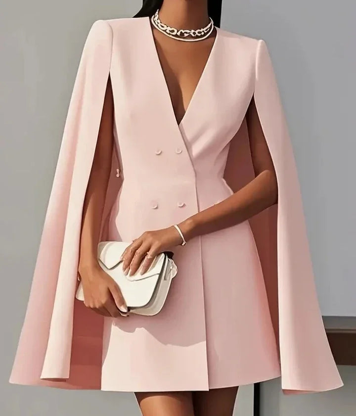 Elegant women's mini dress showcasing a double-breasted front & flowing cape sleeves, a sophisticated party dress.