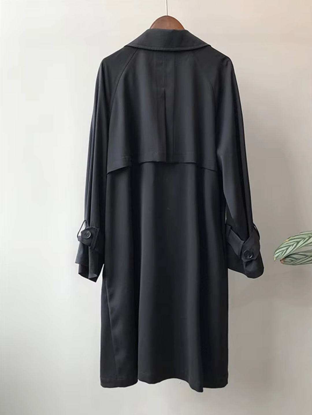 Chic women's double-breasted long trench coat, ideal stylish outerwear for business casual or elegant fashion.