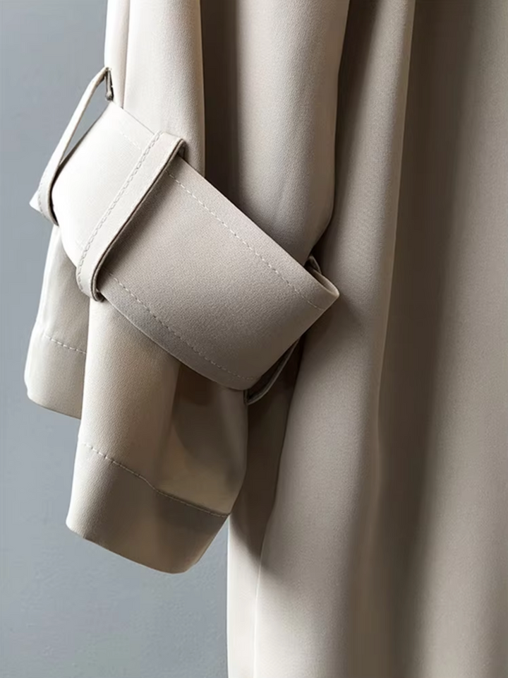 Sophisticated women's double-breasted trench coat; classic, chic, and all-weather long jacket for women.