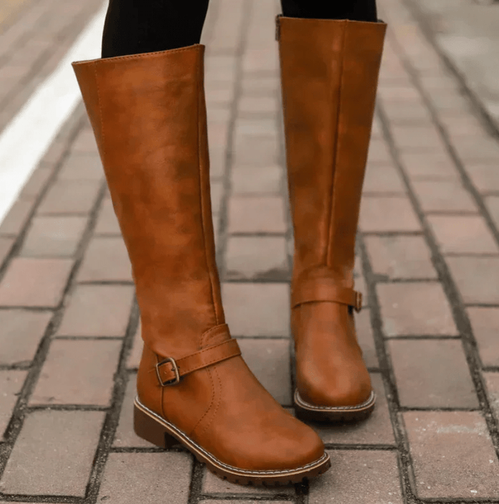 Sturdy sole and tread of women's comfort boots, ensuring grip and all-day support.