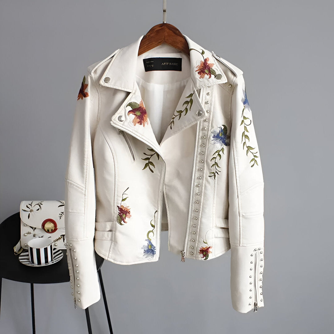 Black women's jacket, heavily studded & embroidered with vibrant florals. Edgy fashion outerwear.