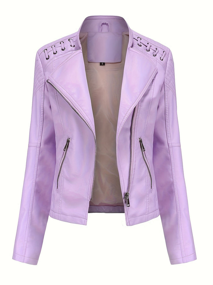 Close-up of studded shoulders on a women's edgy black moto jacket, highlighting biker details.