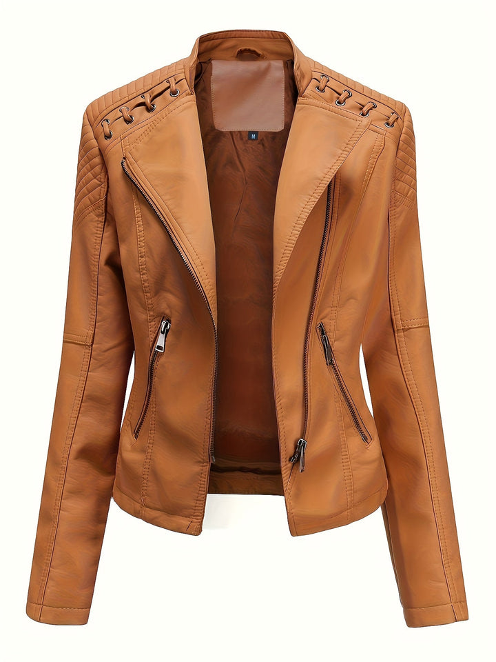 Stylish woman wearing an edgy black zip moto jacket with studded shoulders for a modern biker look.