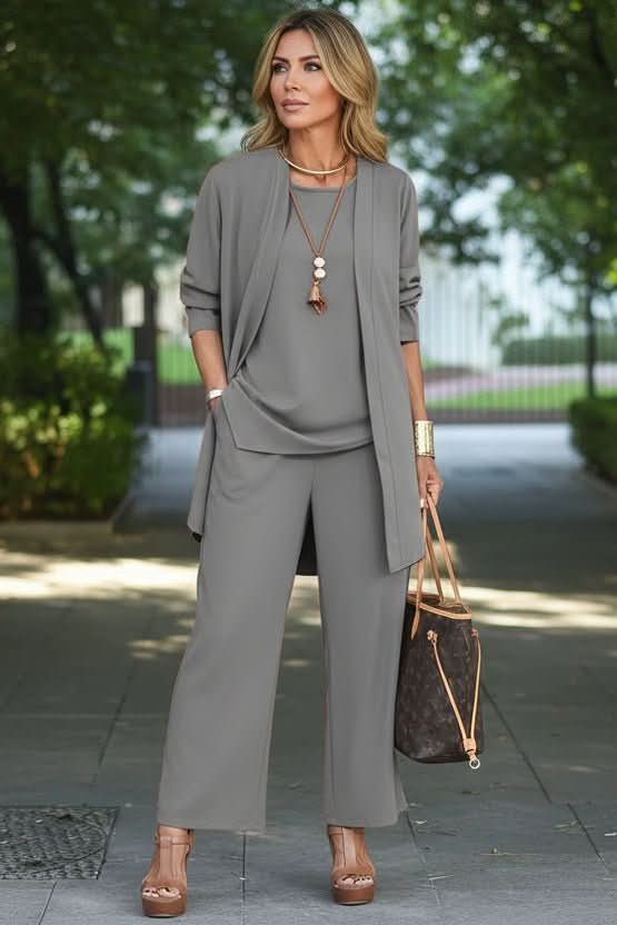 Effortless women's summer set: a soft tank, flowy wide-leg pants, and lightweight cardigan.