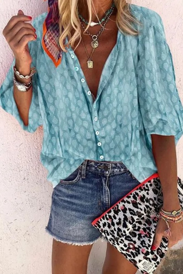 Women's effortless airy button-front blouse. Versatile long sleeve top in a relaxed fit for chic everyday wear.