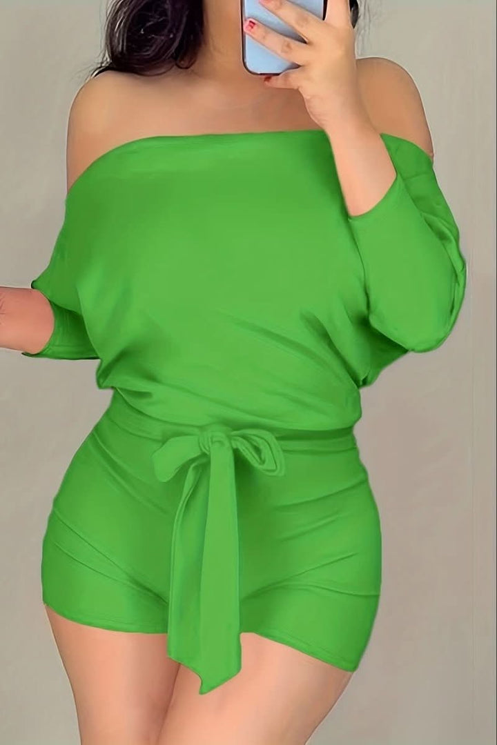 Effortless women's batwing romper, perfect for comfortable beach club style, resort wear, or relaxed summer days.
