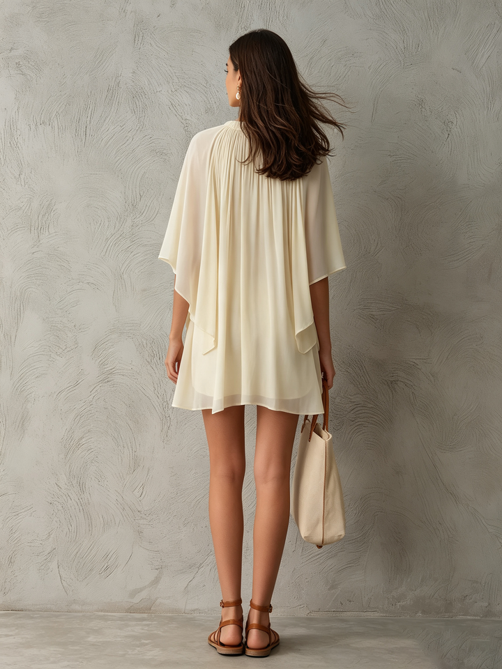 Effortless beige mini dress for women, featuring unique cape sleeves and an A-line cut, great for casual elegance.