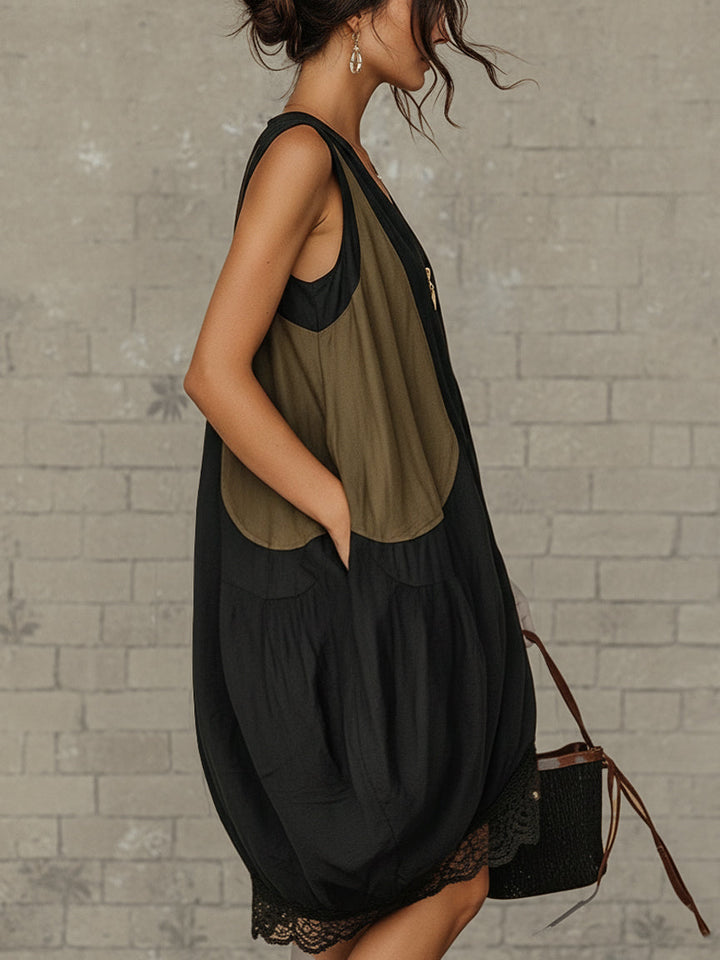 Relaxed fit black midi dress for women, featuring a V-neck and lace hem. Perfect for casual summer & spring wear.