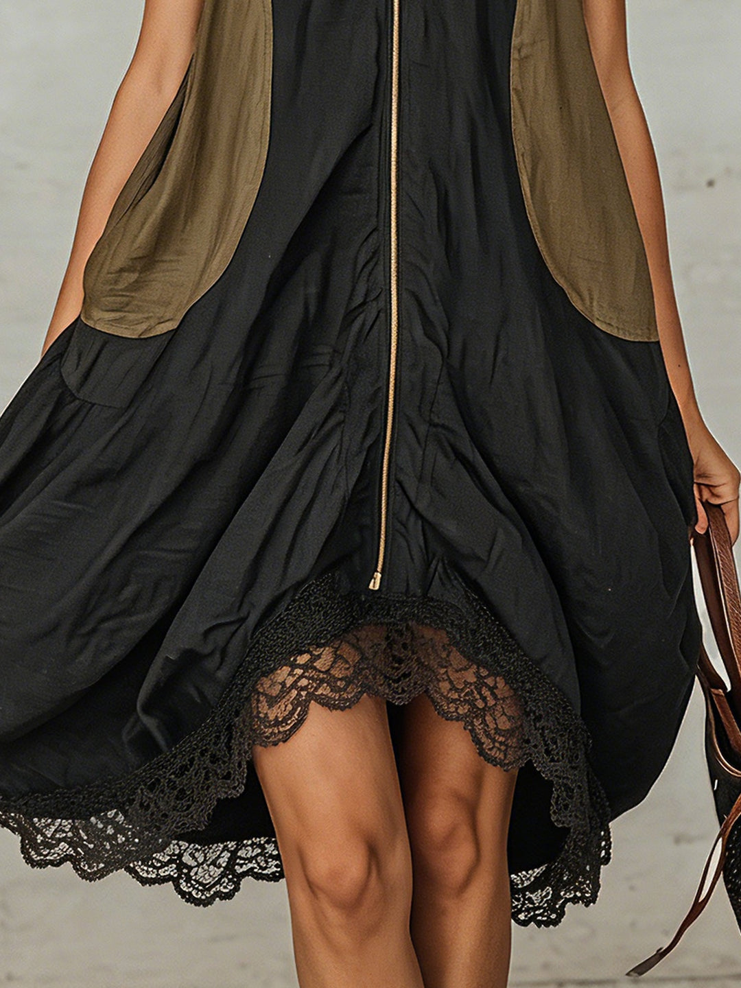 Modern women's black midi dress, V-neck, sleeveless, and stylish lace hem. Versatile for spring, summer & everyday.